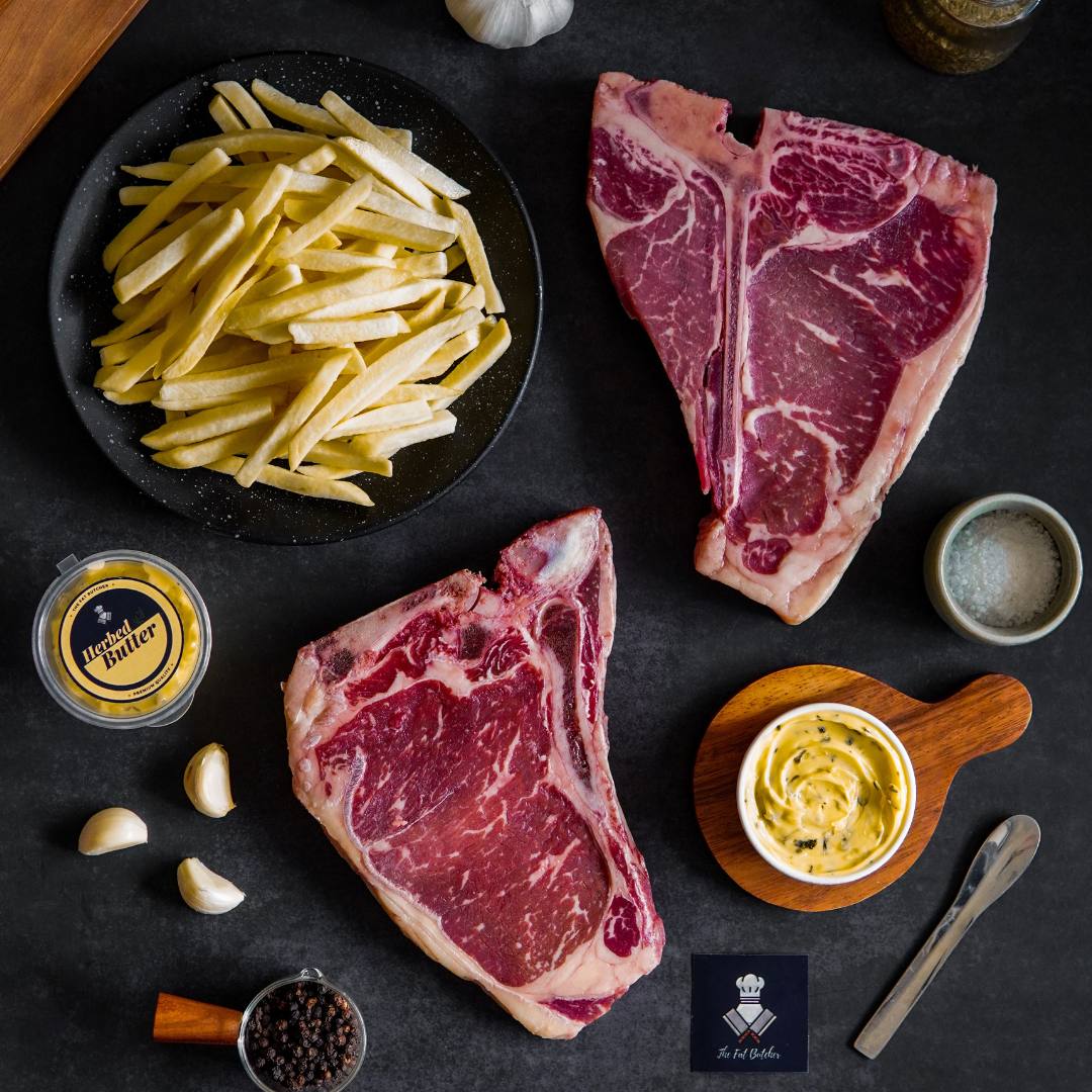 Juicy and tender CAB Porterhouse and CAB T-Bone Steaks paired with our special herbed butter and french fries